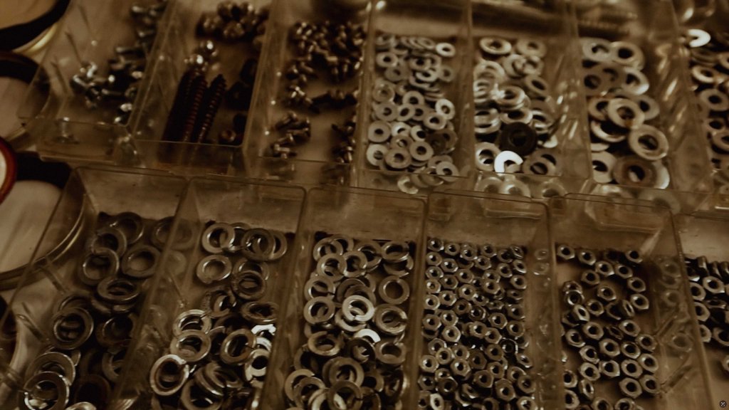 A closeup of well-organized washers and nuts.
